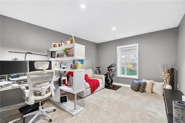 a bedroom with furniture and a window