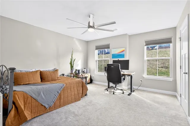 a bedroom with furniture and a window