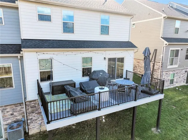 a view of a house with furniture and wooden floor