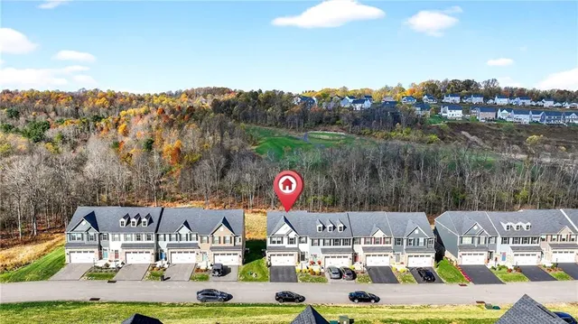 a view of multiple houses with a lake view