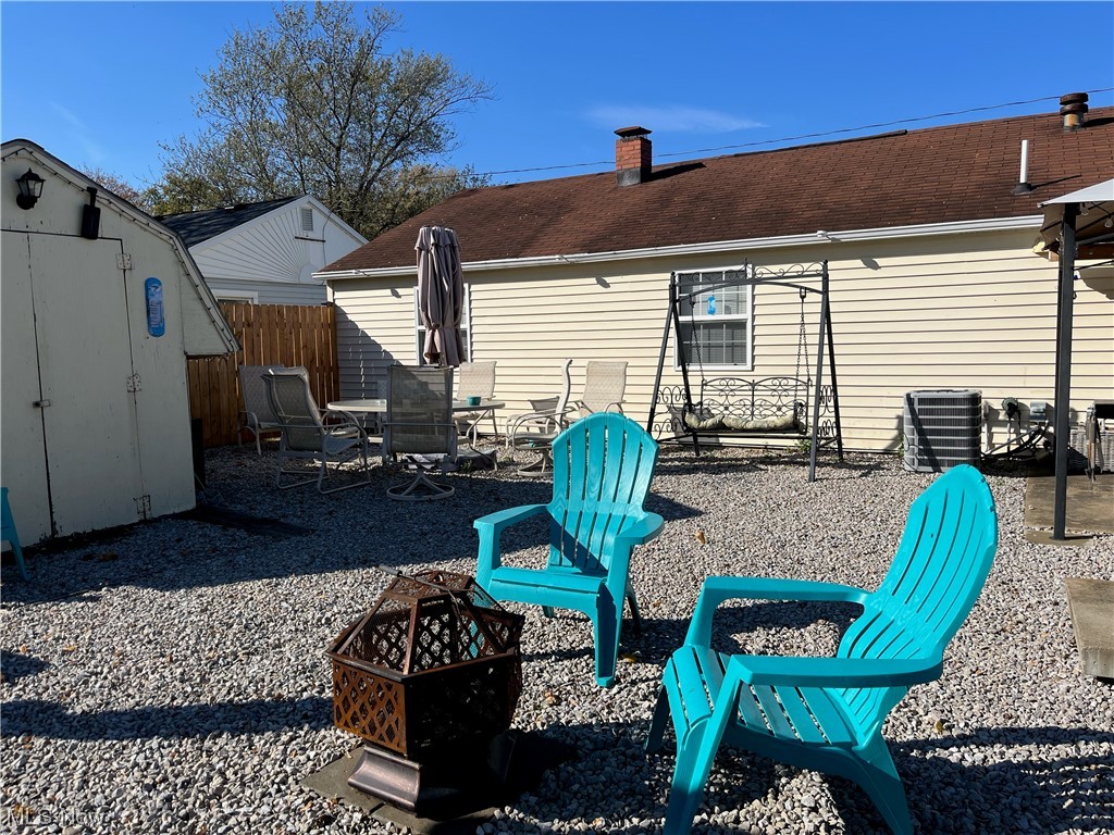 4972 West Fremont Road Port Clinton, OH 43452 - Photo 24 of 29 View of yard with a fire pit and a shed