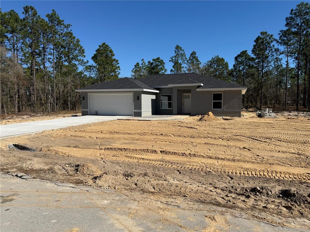 2531 Smallwood Road Dunnellon, FL 34431 - Photo 2 of 15 a house with trees in the background