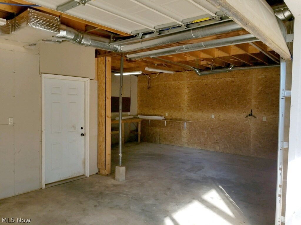 29 Fall Run Road Walker, WV 26180 - Photo 29 of 35 2 car garage with work bench area..door leads into the great room
