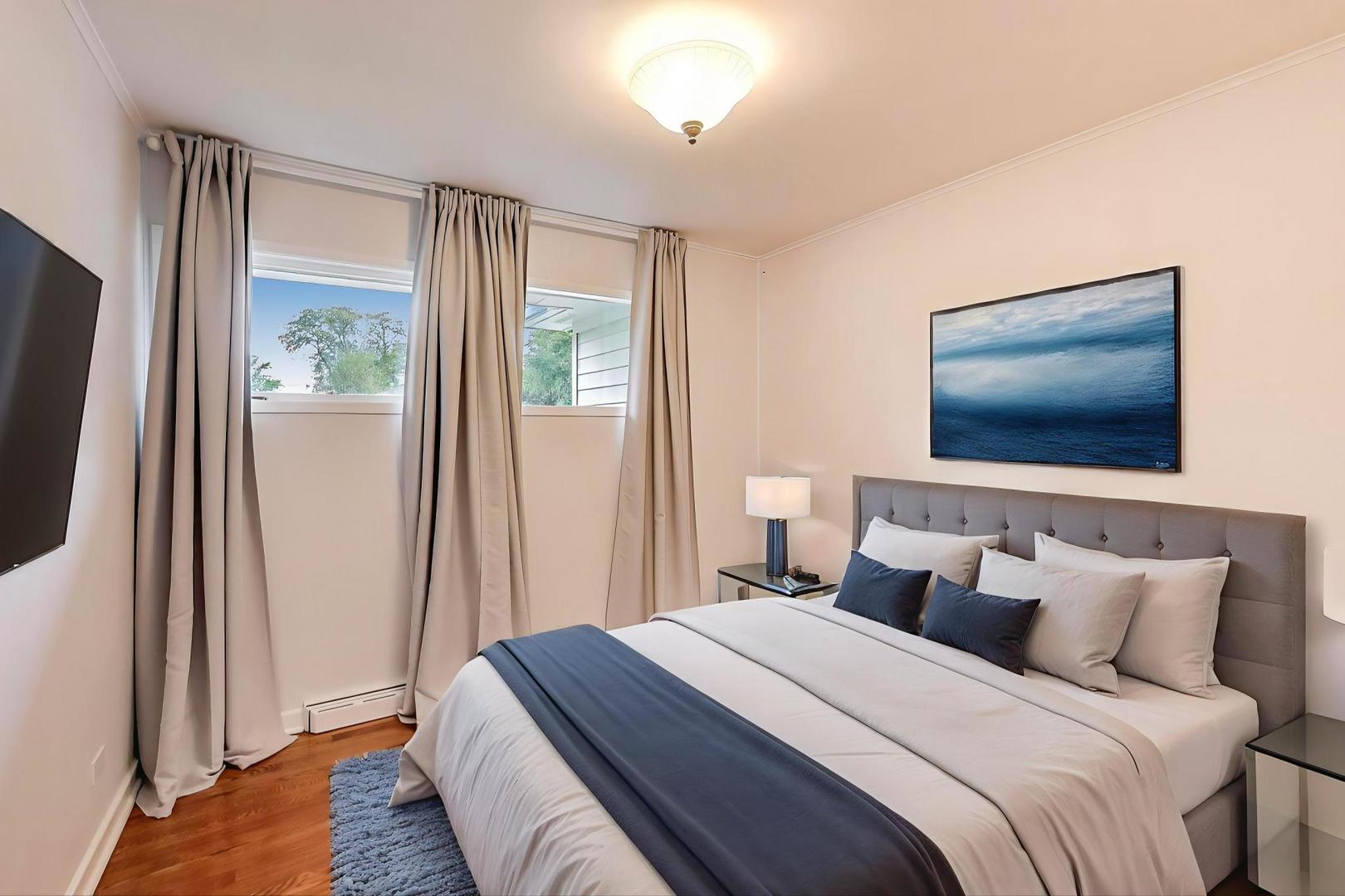 1022 Whitfield Road Northbrook, IL 60062 - Photo 13 of 29 a bedroom with a bed and a flat screen tv