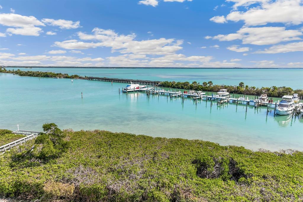 5856 Gasparilla Road, Unit MV26 Boca Grande, FL 33921 - Photo 17 of 38 a view of a lake with houses in the back