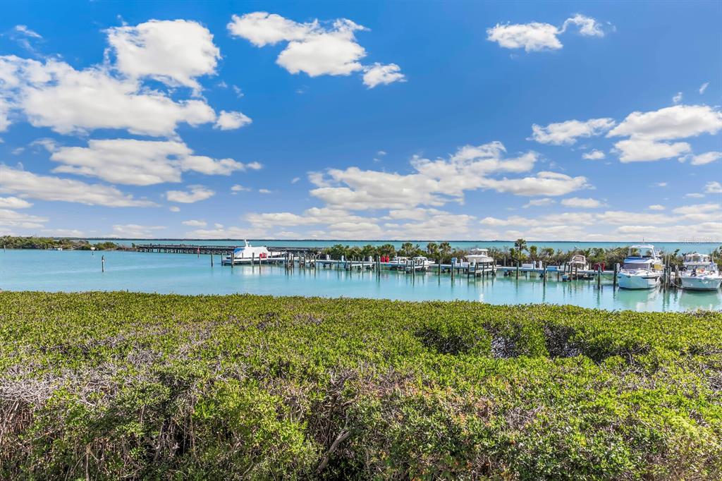 5856 Gasparilla Road, Unit MV26 Boca Grande, FL 33921 - Photo 18 of 38 a view of a lake with houses in the back