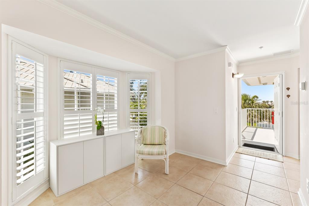 5856 Gasparilla Road, Unit MV26 Boca Grande, FL 33921 - Photo 3 of 38 a living room with furniture and a window