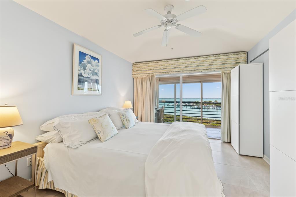 5856 Gasparilla Road, Unit MV26 Boca Grande, FL 33921 - Photo 8 of 38 a bedroom with a bed and a window