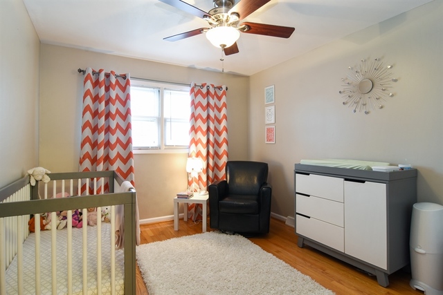 502 South Mt Prospect Road Des Plaines, IL 60016 - Photo 15 of 18 a bedroom with furniture and a window