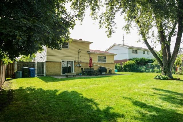 502 South Mt Prospect Road Des Plaines, IL 60016 - Photo 18 of 18 a front view of house with yard and trees