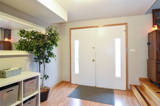 502 South Mt Prospect Road Des Plaines, IL 60016 - Photo 3 of 18 a view of a room with wooden floor and potted plant