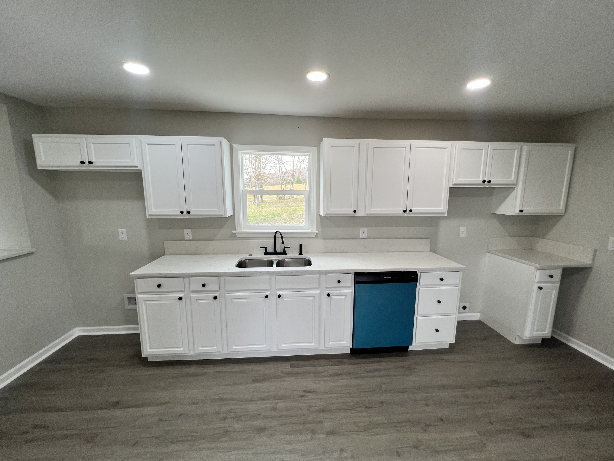 5890 Cainsville Road Lebanon, TN 37090 - Photo 16 of 59 a large white kitchen with granite countertop a stove sink and cabinets