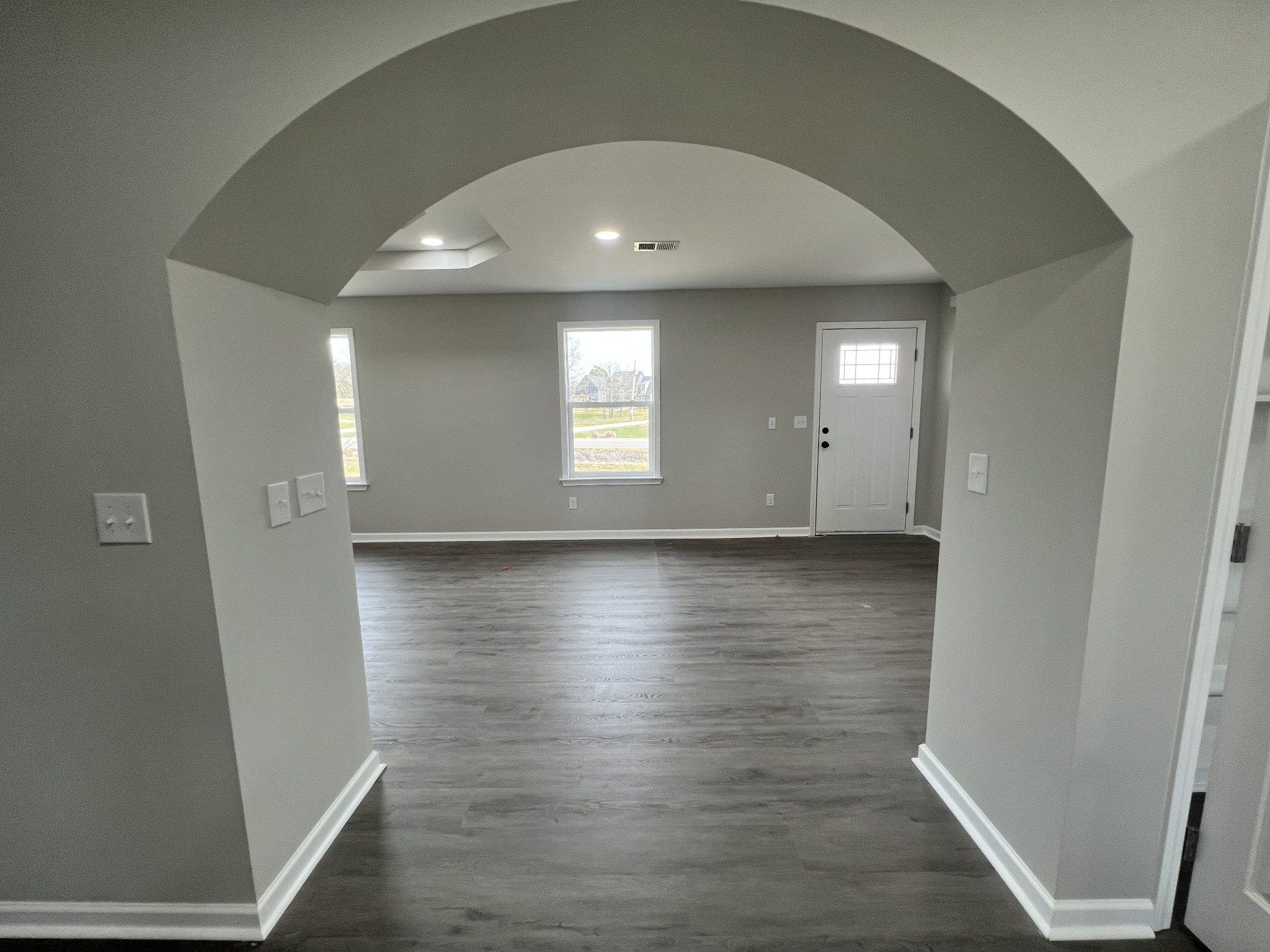 5890 Cainsville Road Lebanon, TN 37090 - Photo 19 of 59 an empty room with wooden floor and windows