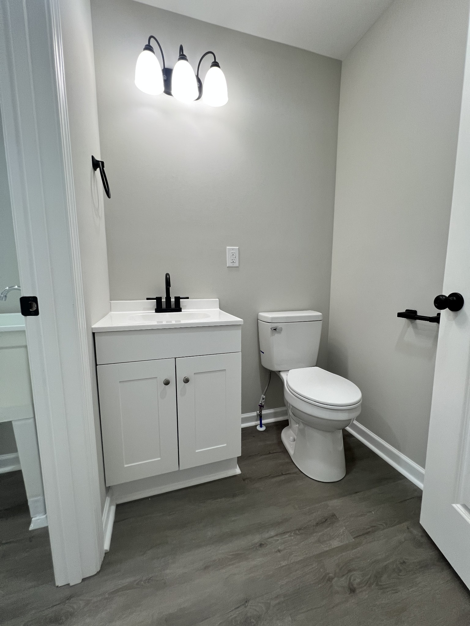 5890 Cainsville Road Lebanon, TN 37090 - Photo 20 of 59 a white toilet sitting next to a bathroom sink