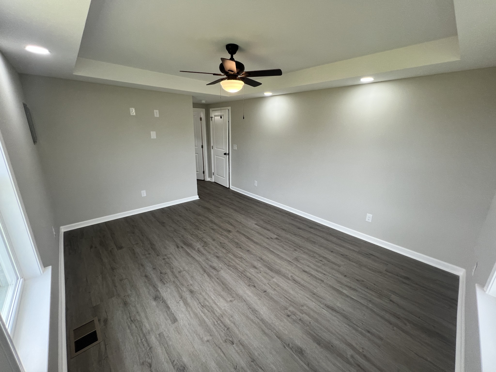 5890 Cainsville Road Lebanon, TN 37090 - Photo 25 of 59 an empty room with wooden floor and chandelier fan