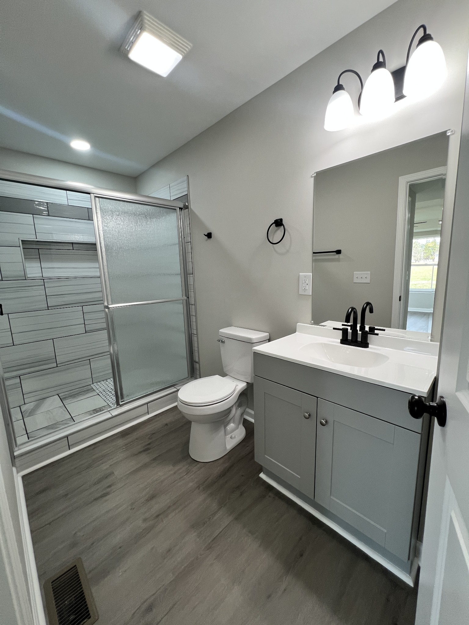5890 Cainsville Road Lebanon, TN 37090 - Photo 27 of 59 a bathroom with a sink and a mirror