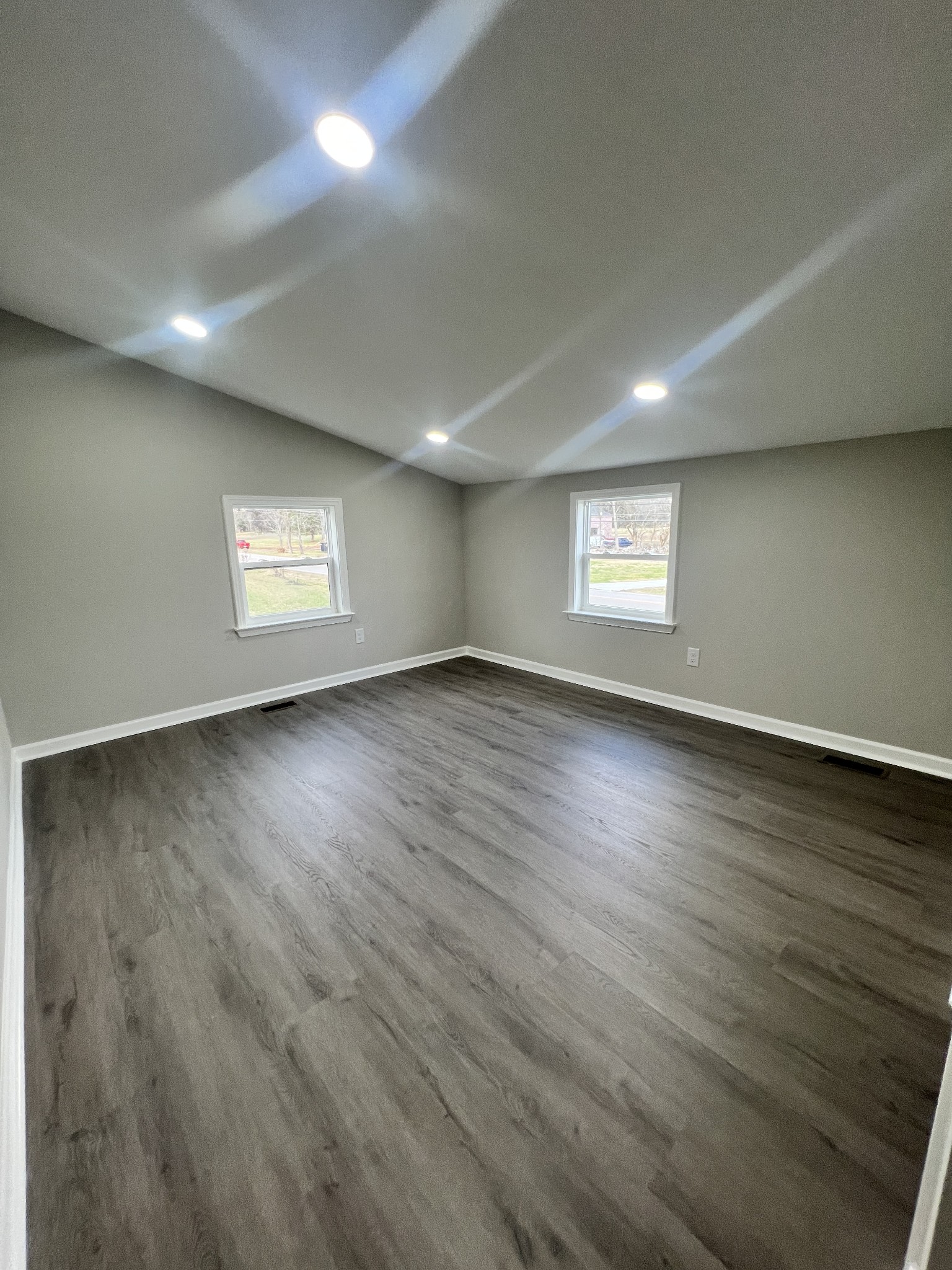5890 Cainsville Road Lebanon, TN 37090 - Photo 43 of 59 an empty room with wooden floor and windows