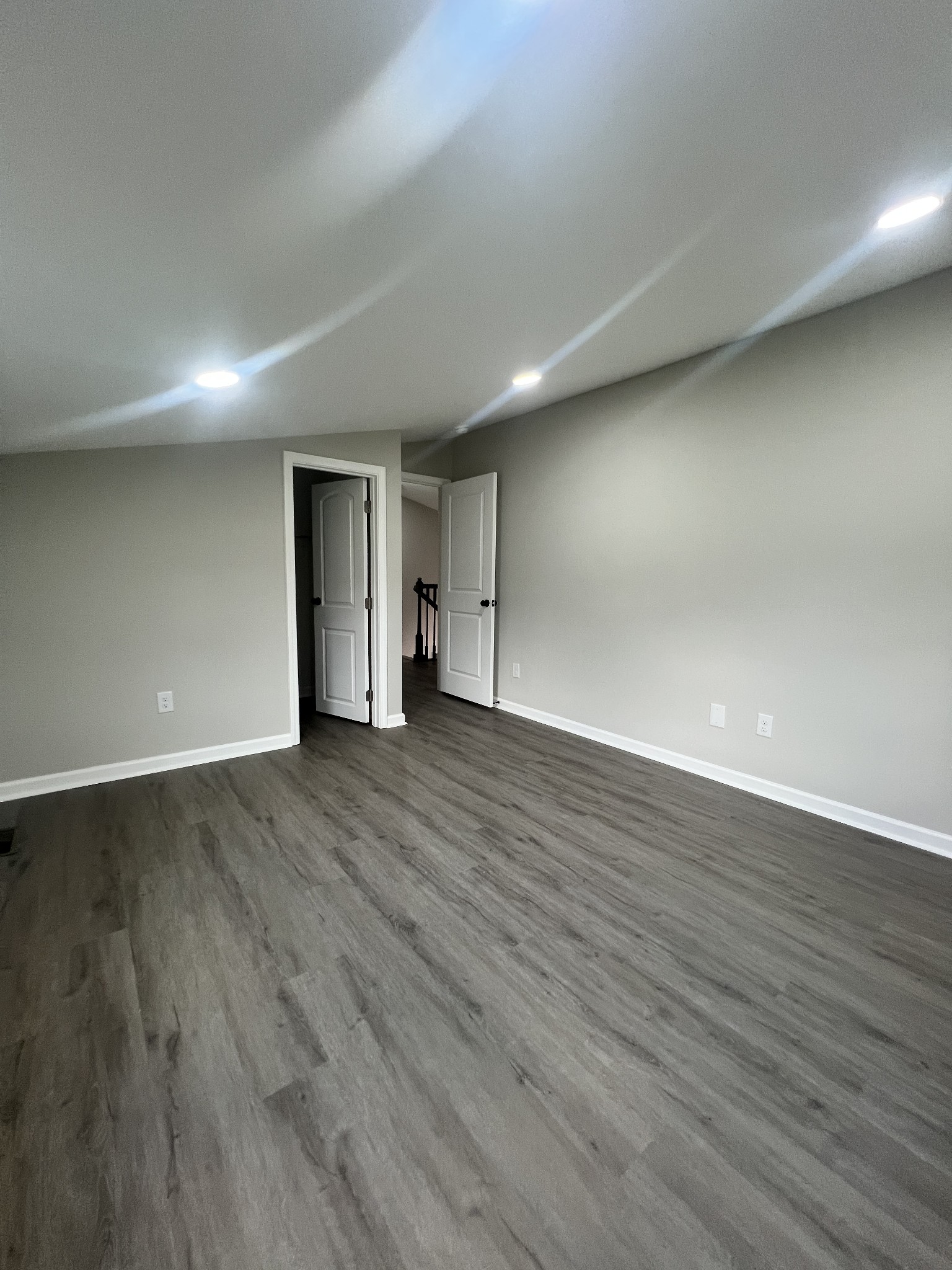 5890 Cainsville Road Lebanon, TN 37090 - Photo 44 of 59 a view of an empty room with wooden floor and closet
