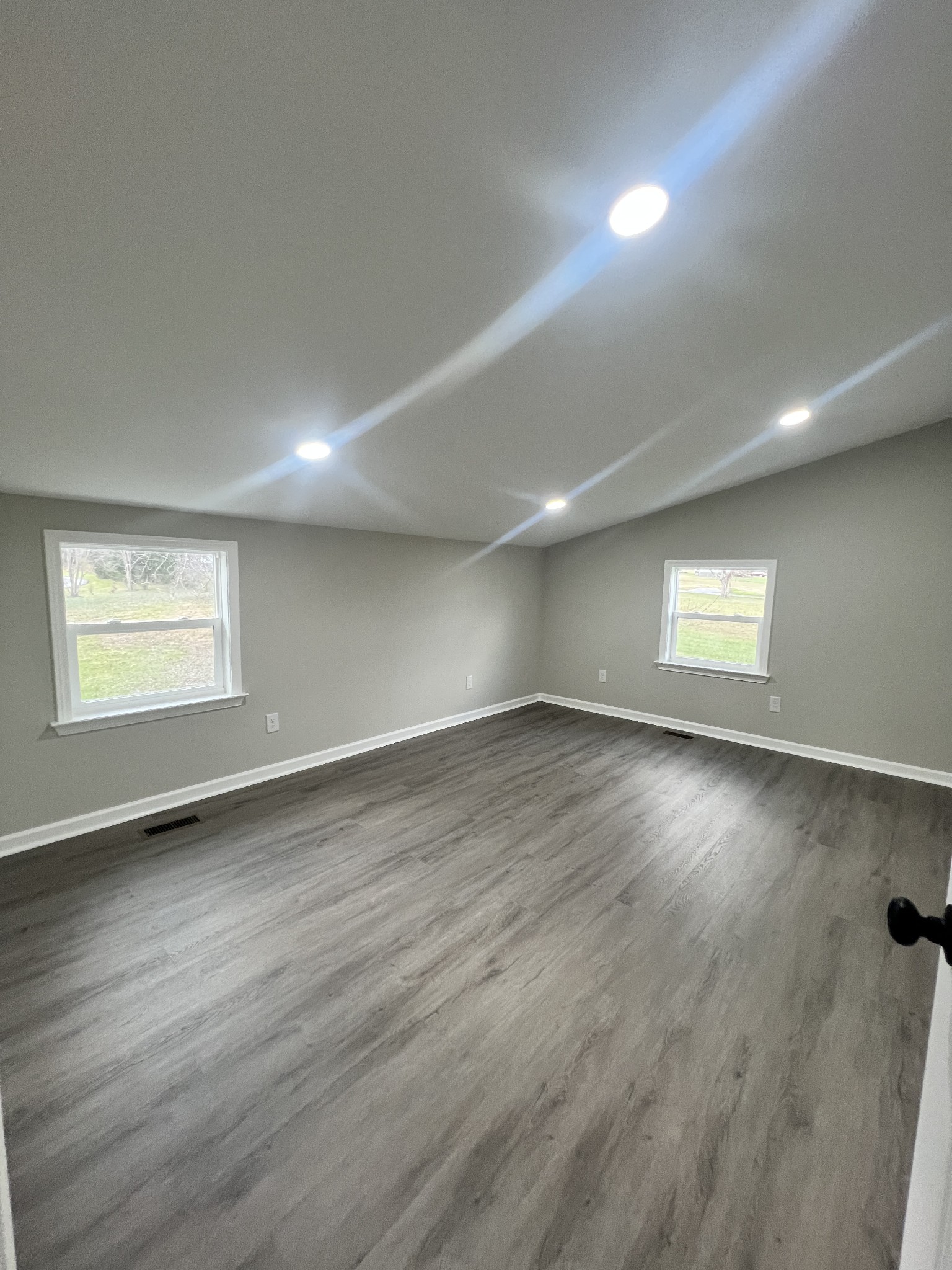 5890 Cainsville Road Lebanon, TN 37090 - Photo 46 of 59 an empty room with wooden floor and windows