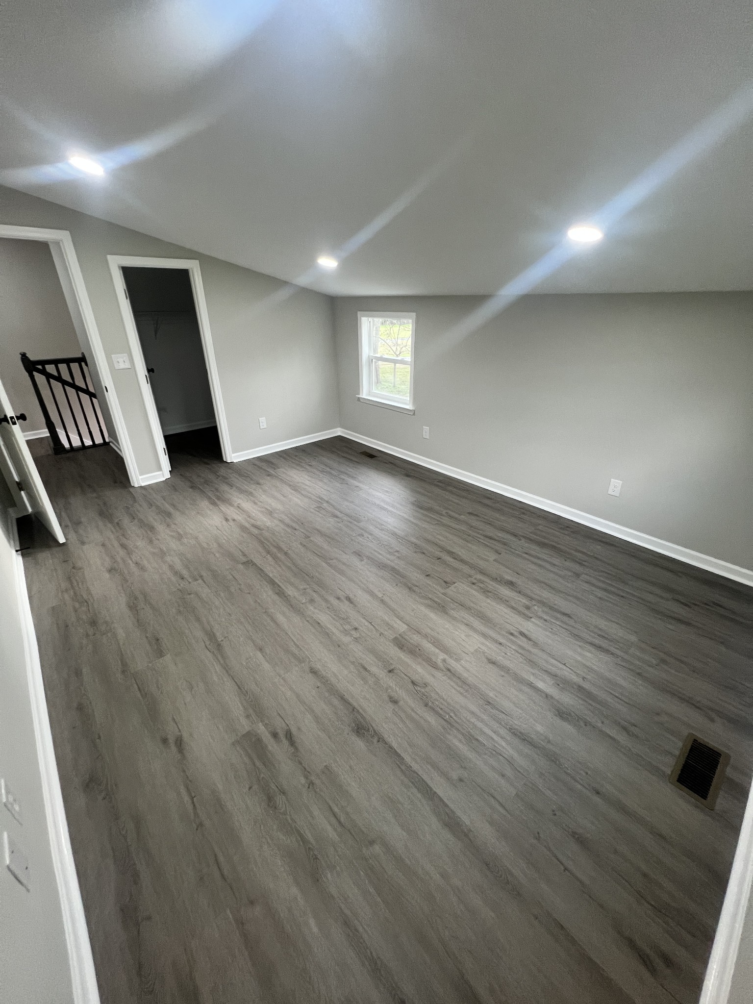 5890 Cainsville Road Lebanon, TN 37090 - Photo 47 of 59 an empty room with wooden floor and windows