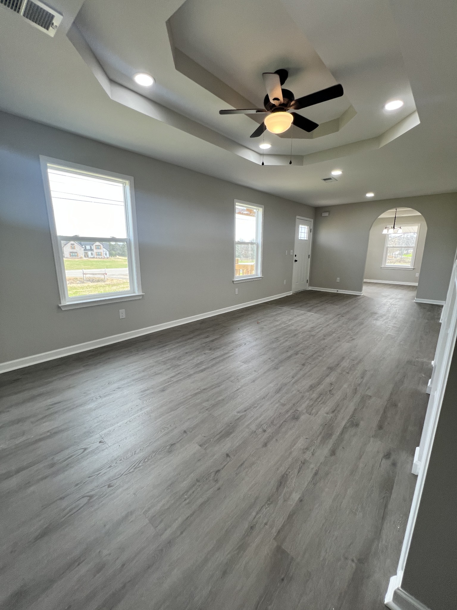 5890 Cainsville Road Lebanon, TN 37090 - Photo 10 of 59 an empty room with wooden floor and windows