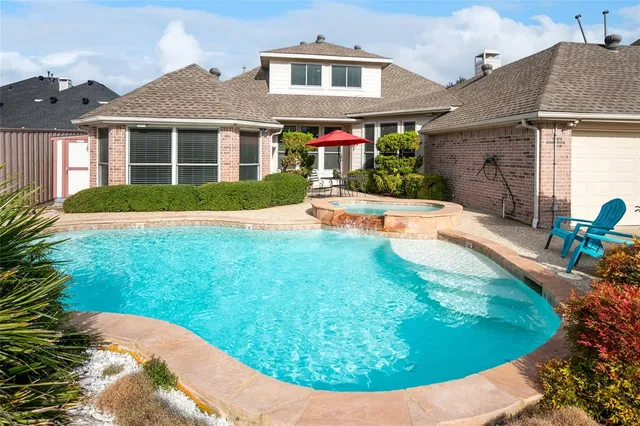 a view of a swimming pool with a patio
