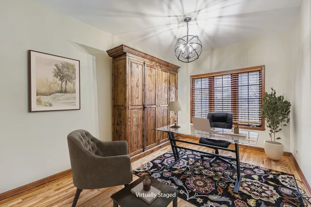 a living room with furniture a piano and a window