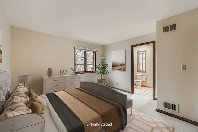 a bedroom with a bed and a mirror