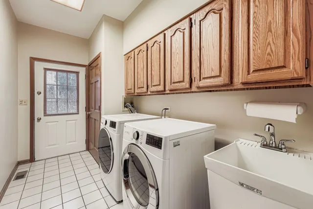 a utility room with dryer and washer