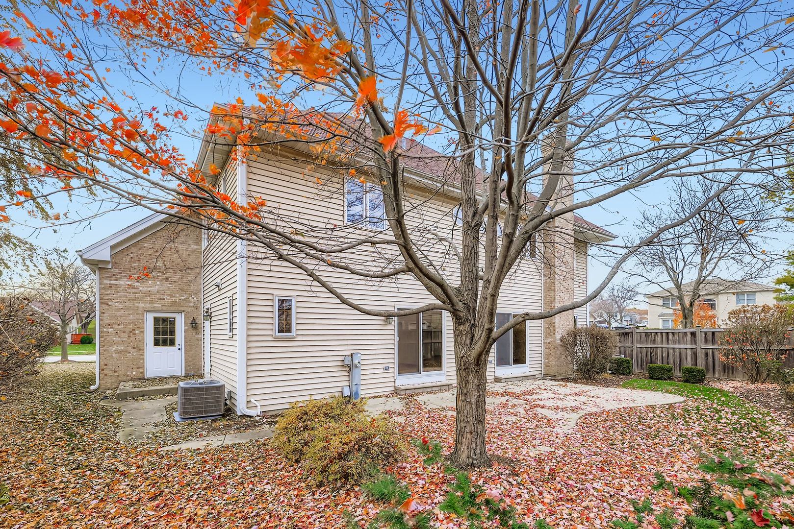 845 Harmon Boulevard Hoffman Estates, IL 60169 - Photo 32 of 33 a white house that has a tree in front of it