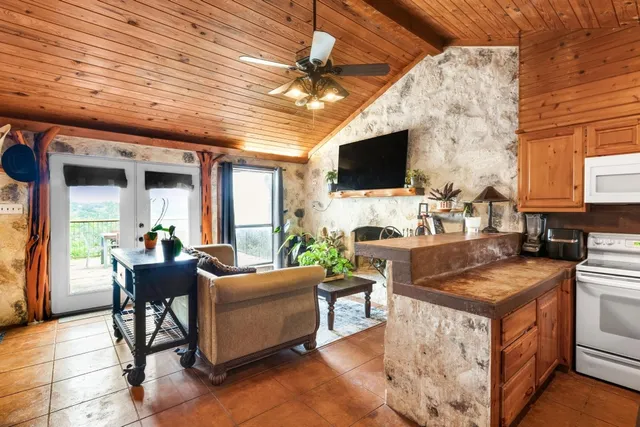 a view of a livingroom with furniture and a flat screen tv