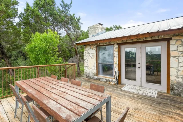 a view of a chairs and table in the patio