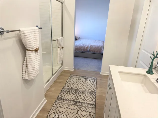 a bedroom with a bed and a rug