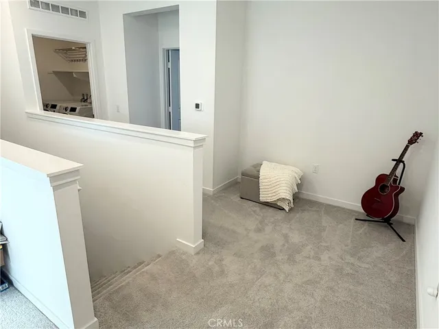 a room with a cabinet and a mirror