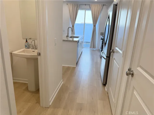 a view of a bathroom with sink and mirror