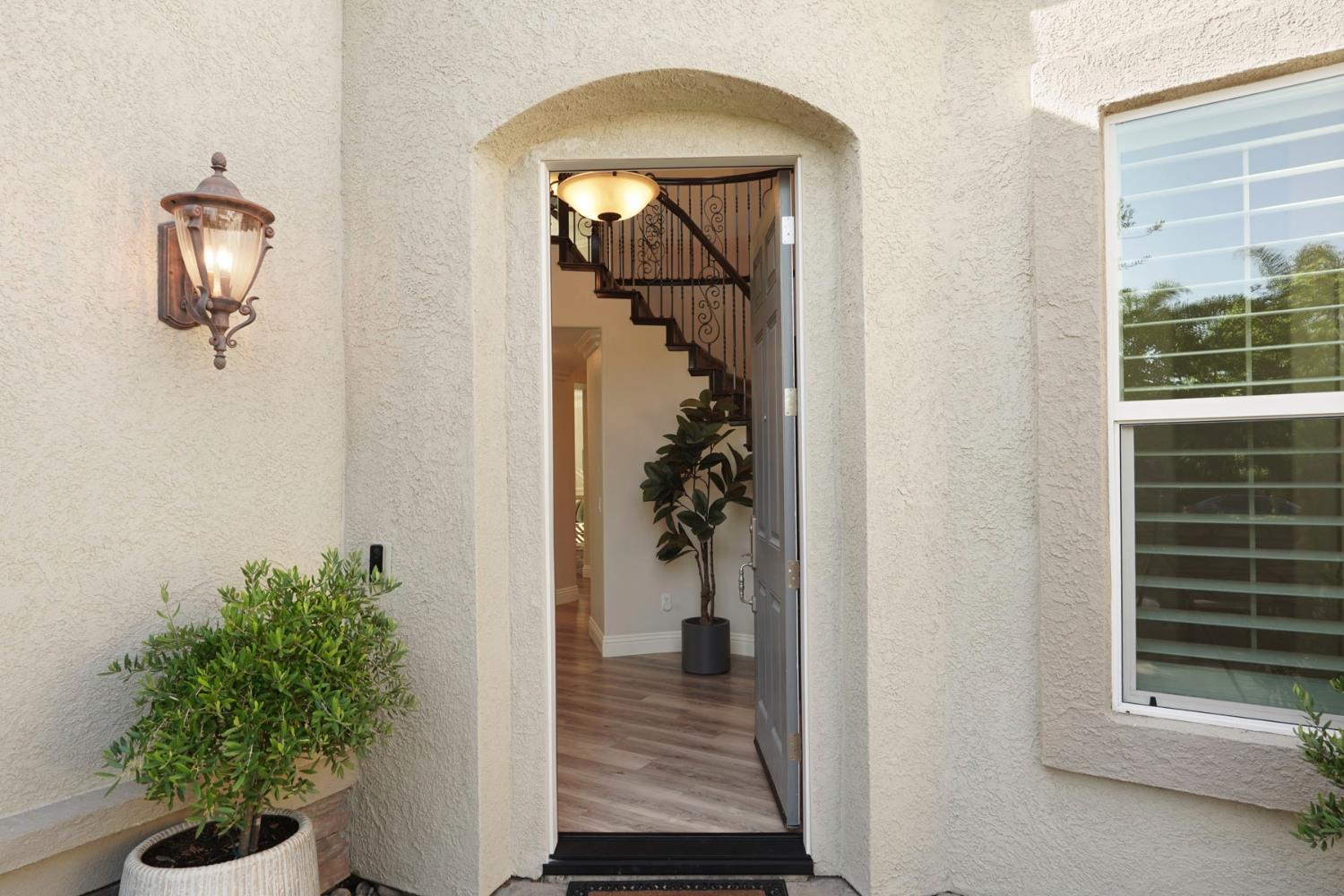 2227 Heavenly Way Lodi, CA 95242 - Photo 12 of 62 a view of a hallway to a livingroom and a potted plant