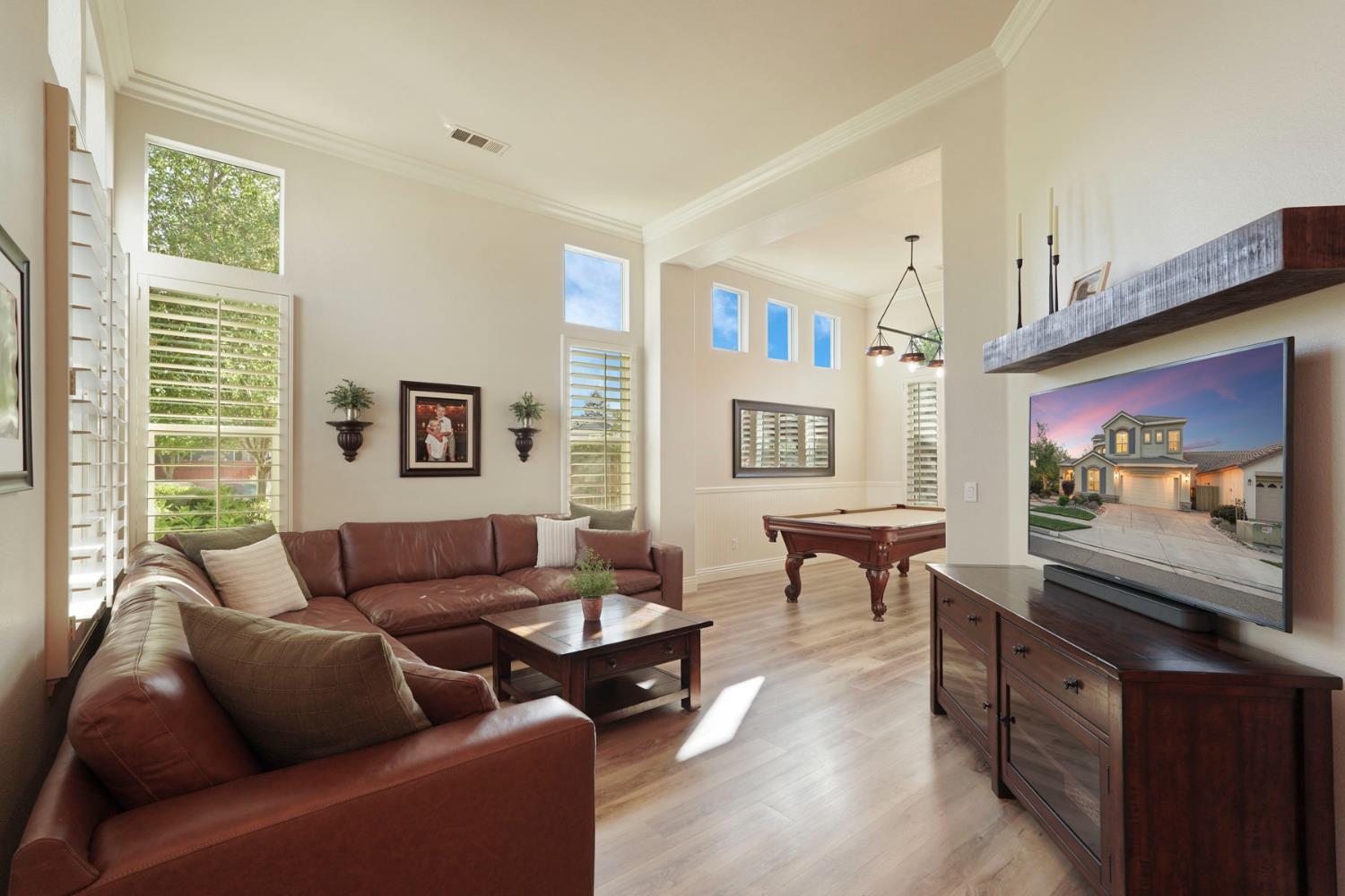 2227 Heavenly Way Lodi, CA 95242 - Photo 13 of 62 a living room with furniture a large window and a flat screen tv