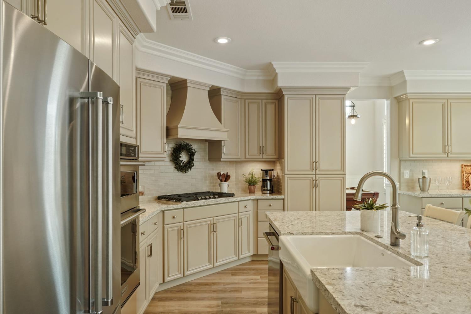 2227 Heavenly Way Lodi, CA 95242 - Photo 25 of 62 a kitchen with stainless steel appliances granite countertop a sink stove and refrigerator