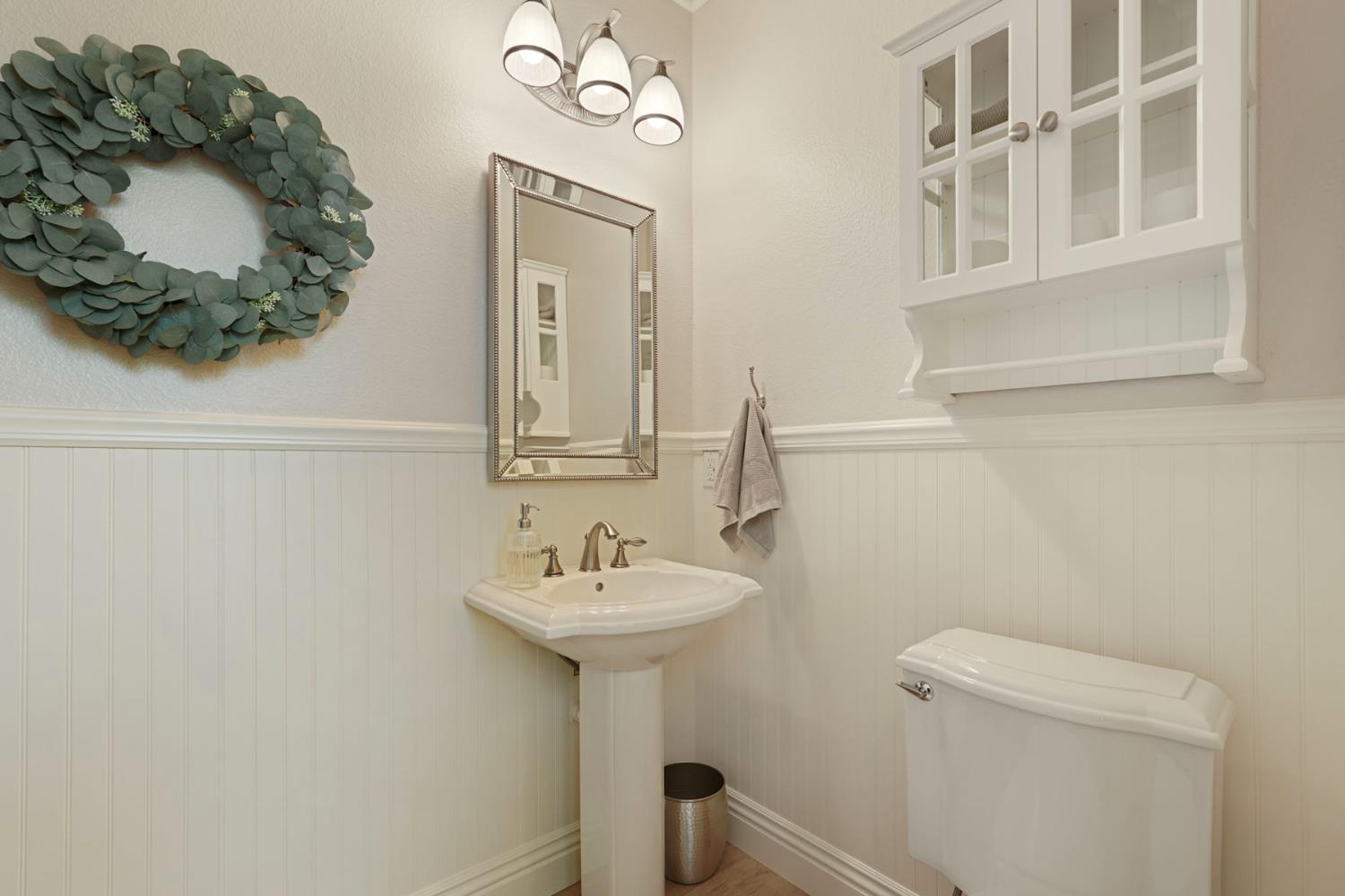 2227 Heavenly Way Lodi, CA 95242 - Photo 31 of 62 a bathroom with a sink a mirror and toilet