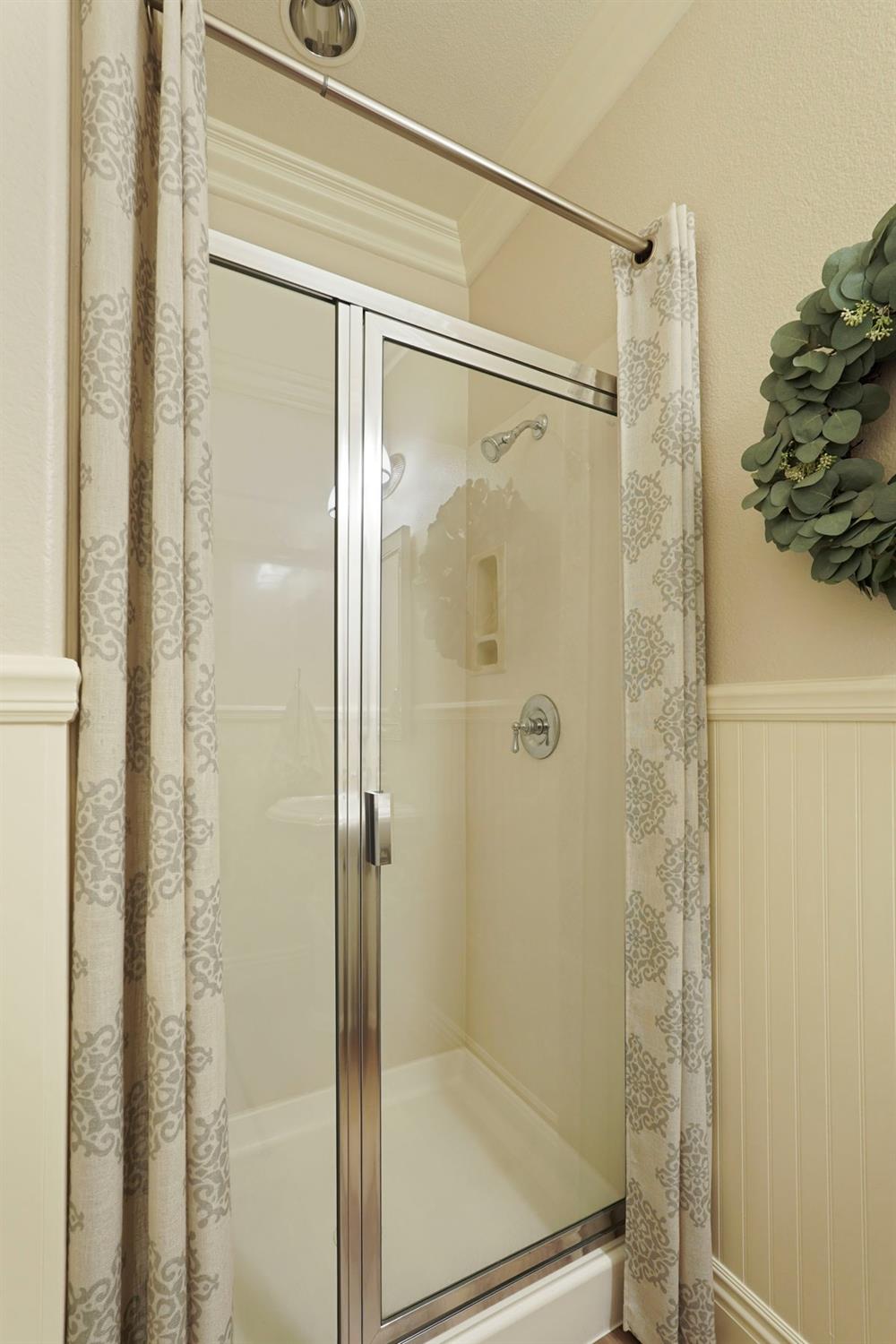 2227 Heavenly Way Lodi, CA 95242 - Photo 32 of 62 a bathroom with a glass shower door