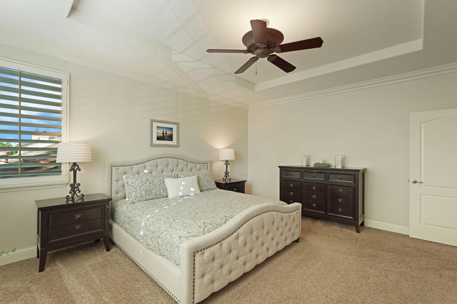 2227 Heavenly Way Lodi, CA 95242 - Photo 38 of 62 a bedroom with a bed and ceiling fan