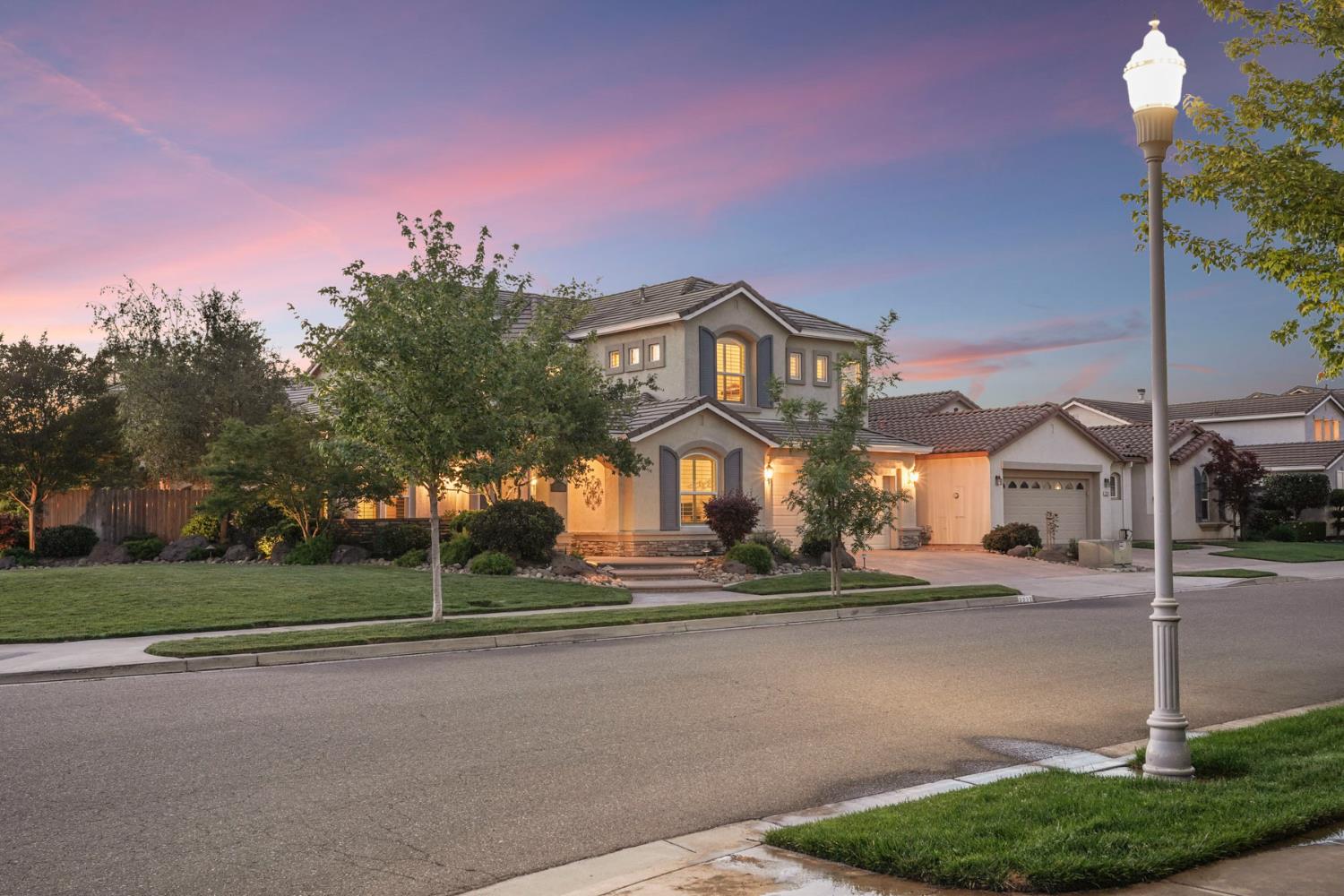 2227 Heavenly Way Lodi, CA 95242 - Photo 5 of 62 a front view of a house with a yard