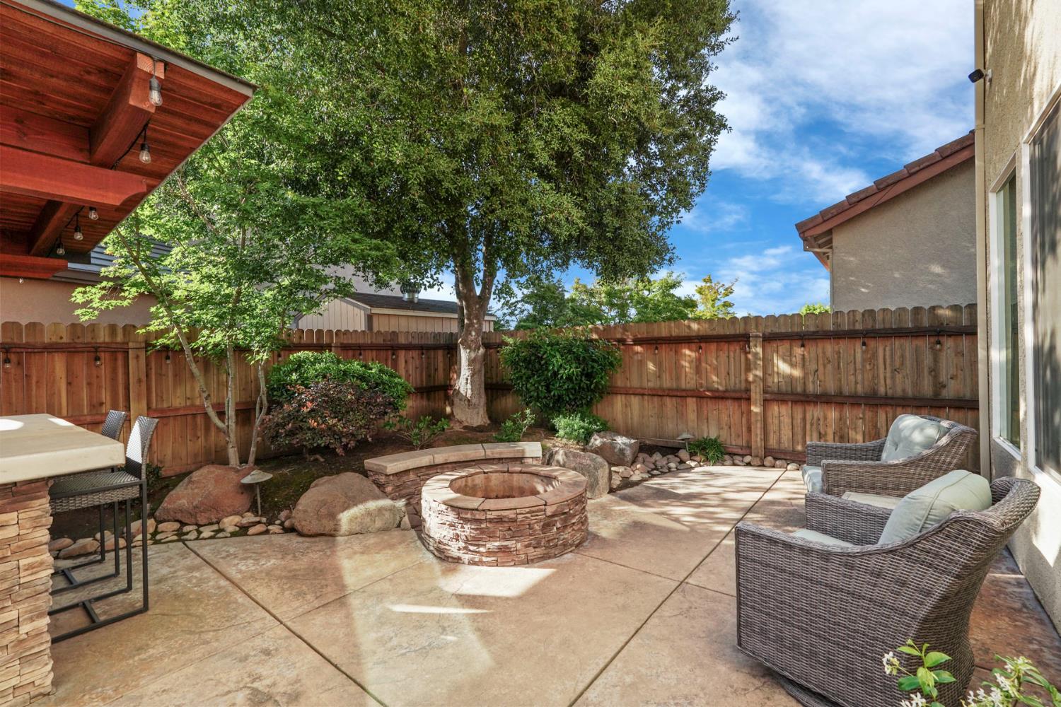 2227 Heavenly Way Lodi, CA 95242 - Photo 51 of 62 a view of a patio with couches and a table and chairs with wooden fence
