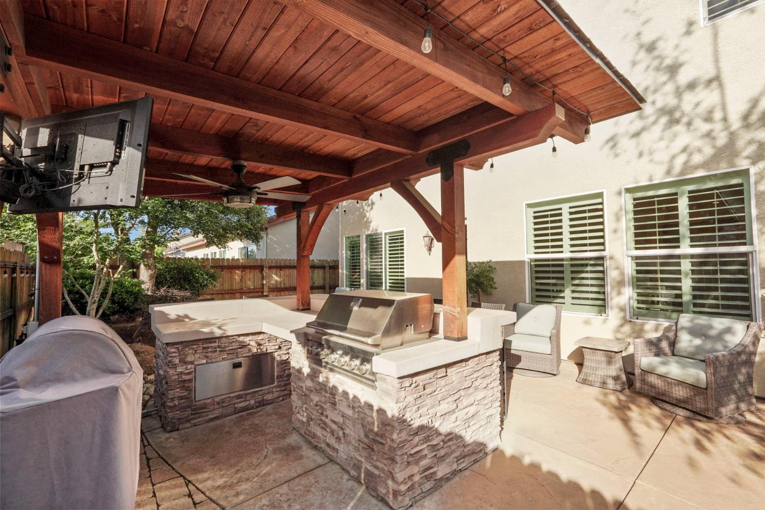 2227 Heavenly Way Lodi, CA 95242 - Photo 56 of 62 a view of a patio with couches chairs and a potted plant