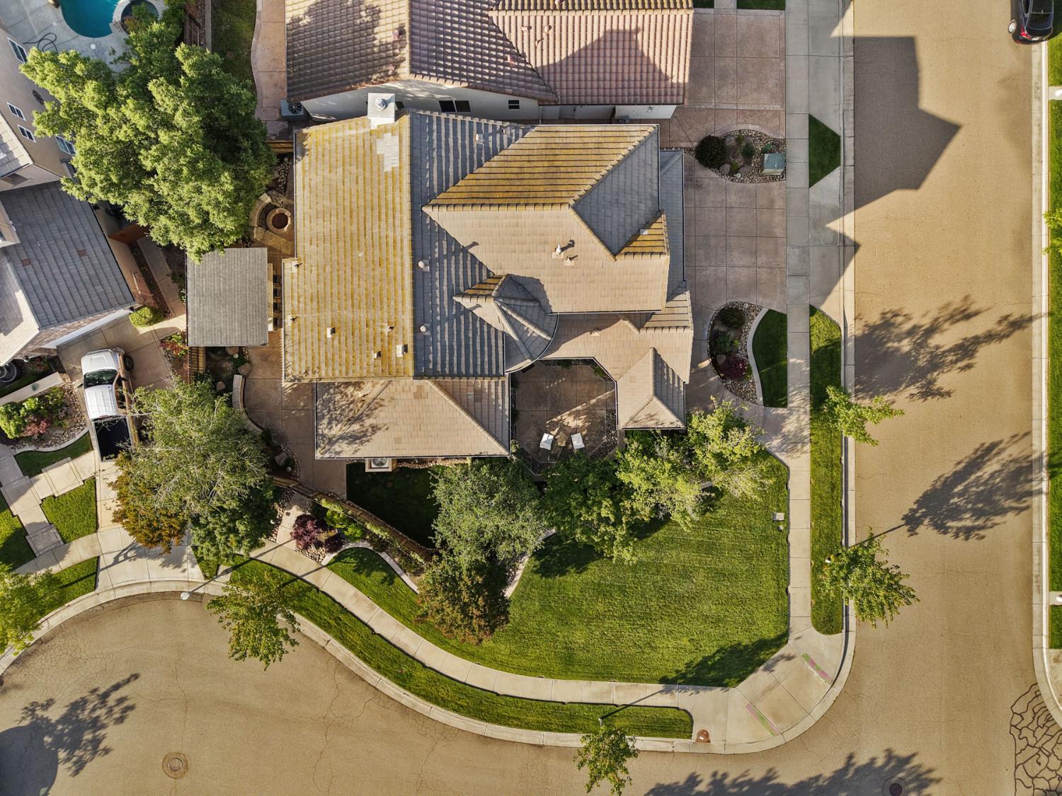 2227 Heavenly Way Lodi, CA 95242 - Photo 10 of 62 an aerial view of a house with a yard and large trees