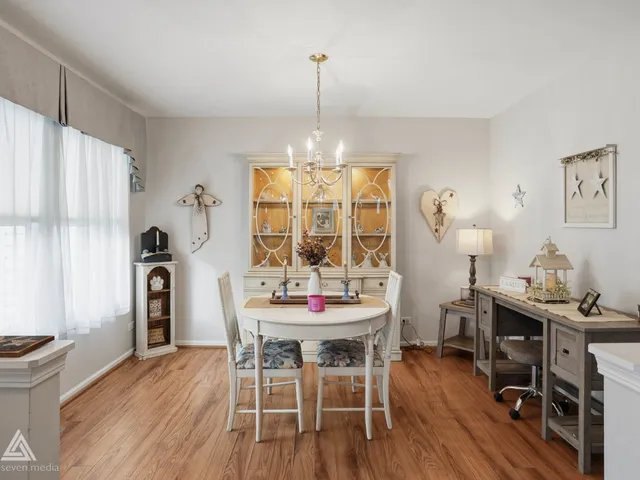 a dining room with furniture window wooden floor