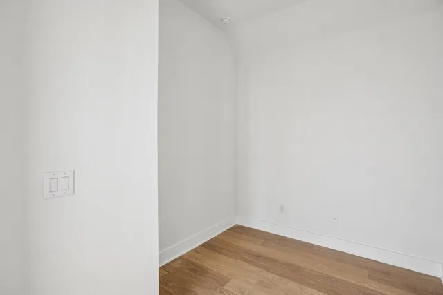 a view of a small space with wooden floor