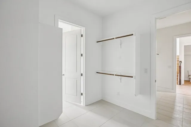 a spacious bathroom with a double vanity sink mirror and double