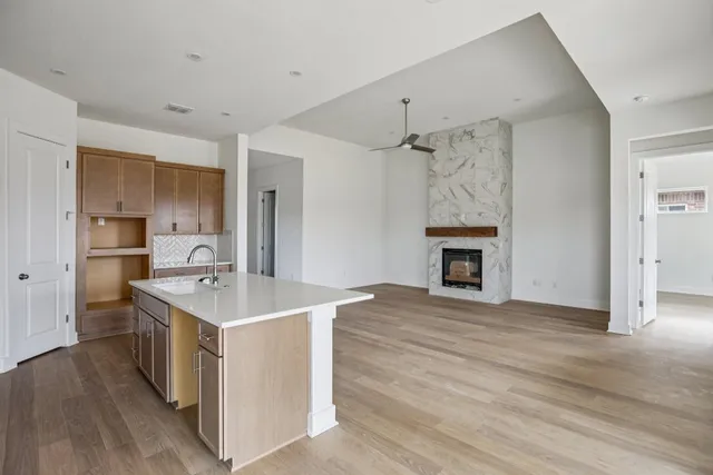 a kitchen with a sink stove and refrigerator