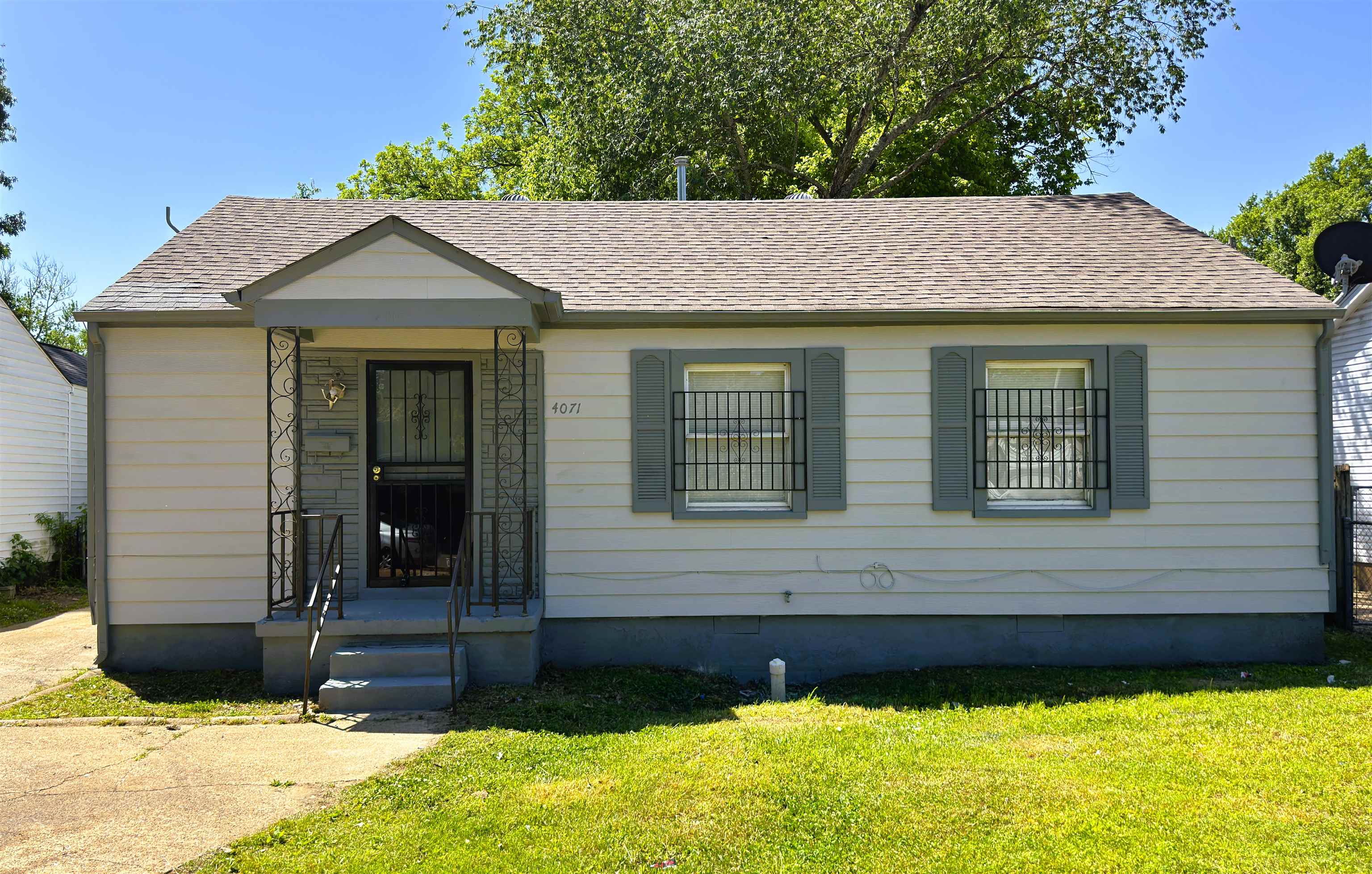 4071 Grey Road Memphis, TN 38108 - Photo 1 of 15 a house with a garden